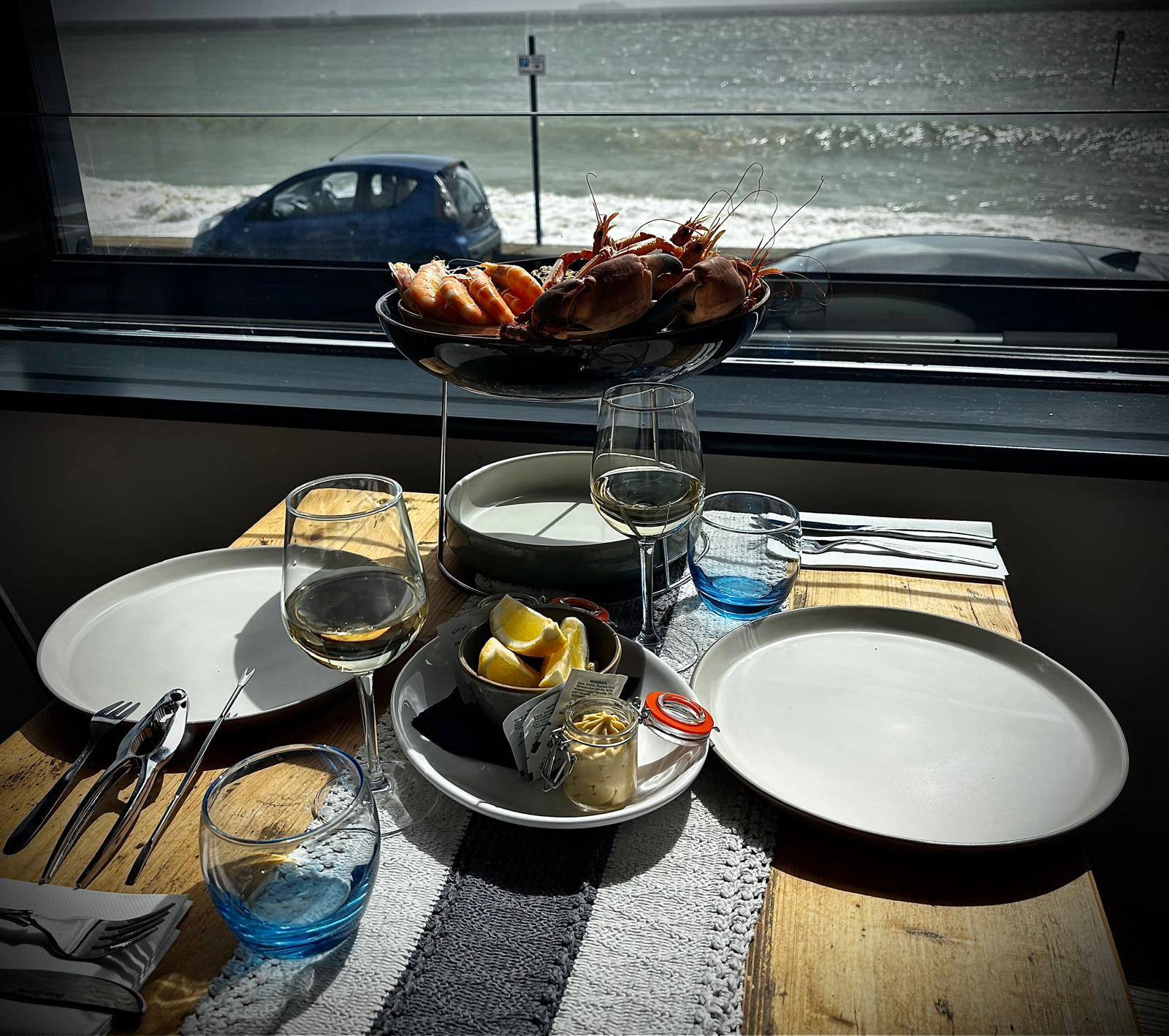 Candlelit interior of Le Goût de la Mer overlooking the sea
